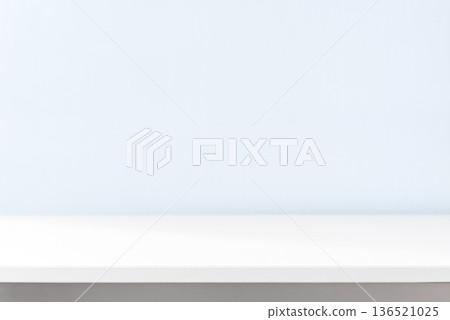 White table against blue wall White table against blue wall 136521025