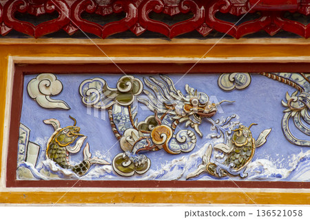 Detail Of Ceramic Mosaic Dragon And Fish Of A Palace In Hue Imperial Citadel, Vietnam. Detail Of Ceramic Mosaic Dragon And Fish Of A Palace In Hue Imperial Citadel, Vietnam. 136521058