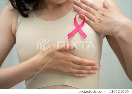 Asian woman with pink ribbon for October world breast cancer day. 136521095