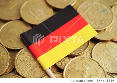 Germany flag on coin and banknote money, finance trading investment business currency concept. Germany flag on coin and banknote money, finance trading investment business currency concept. 136521116