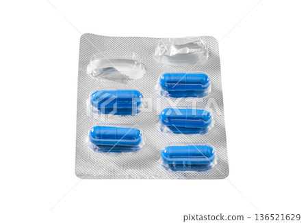 blue medical capsules in the started blister isolated on white with clipping path  136521629