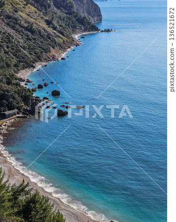 Aerial View of Mountains Sea and Sandy Beach Aerial View of Mountains Sea and Sandy Beach 136521672