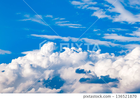 white cumulus clouds in a blue sky white cumulus clouds in a blue sky 136521870