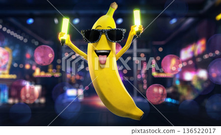 Banana character poses joyfully with bright sticks in a lively, colorful setting during an exciting event Banana character poses joyfully with bright sticks in a lively, colorful setting during an exciting event 136522017