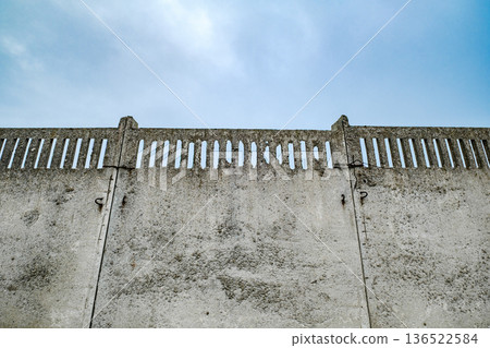 concrete sectional solid fence against the sky concrete sectional solid fence against the sky 136522584