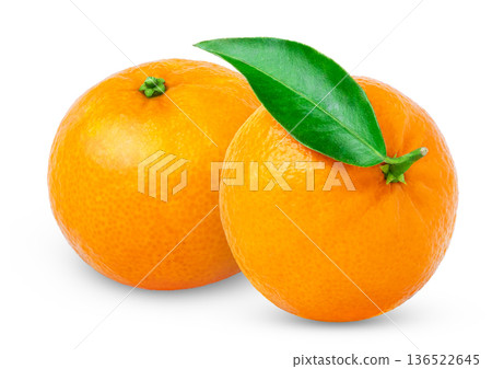 Two ripe tangerine fruits. Organic mandarins fruit isolated. Clementine orange citrus fruit with green leaf isolated. Two ripe tangerine fruits. Organic mandarins fruit isolated. Clementine orange citrus fruit with green leaf isolated. 136522645