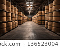 Cheese storage facility with stacked wheels in industrial warehouse setting 136523004