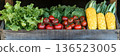 Fresh garden vegetables in wooden crate: lettuce, tomatoes, cabbage, corn display 136523005
