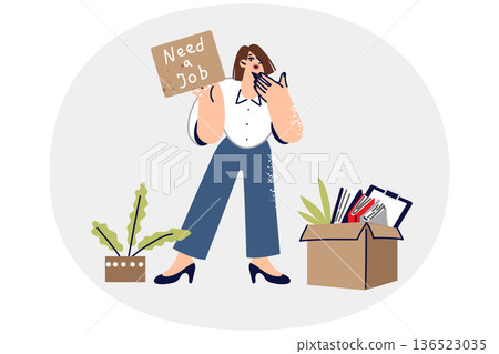 Fired woman shows inscription need job, standing near dismissal box and trying to find new employer Fired woman shows inscription need job, standing near dismissal box and trying to find new employer 136523035
