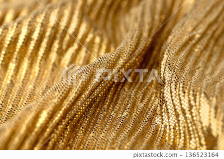 A close-up shot of gold sequin fabric for backgrounds or design elements A close-up shot of gold sequin fabric for backgrounds or design elements 136523164
