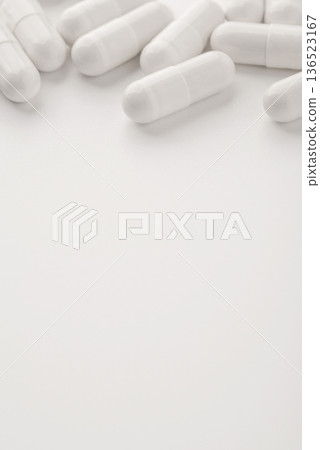 White pills on a white background. Close up White pills on a white background. Close up 136523167