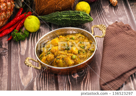 Aloo masala with green peas Aloo masala with green peas 136523297