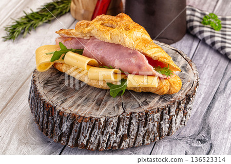 Fresh croissant with ham and cheese Fresh croissant with ham and cheese 136523314