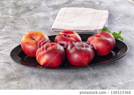 Ripe sweet juicy flat nectarines heap Ripe sweet juicy flat nectarines heap 136523368