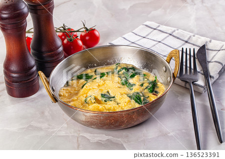 Omelette with spinach for breakfast Omelette with spinach for breakfast 136523391