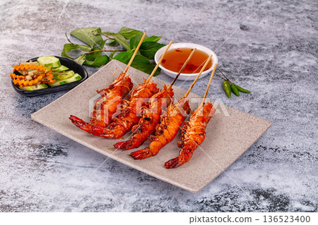 Grilled prawn skewer served sauce Grilled prawn skewer served sauce 136523400