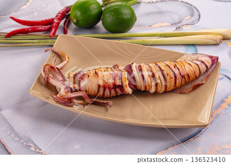 Tasty grilled wild squid with lime Tasty grilled wild squid with lime 136523410