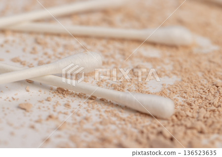 old scattered broken cosmetics, makeup powder , dust and small and large pieces of women's cosmetics that were broken and ruined, close up 136523635