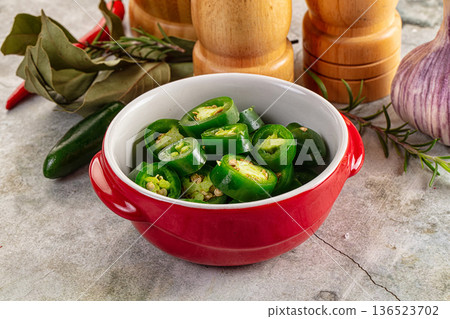 Hot spicy sliced jalapeno pepper 136523702