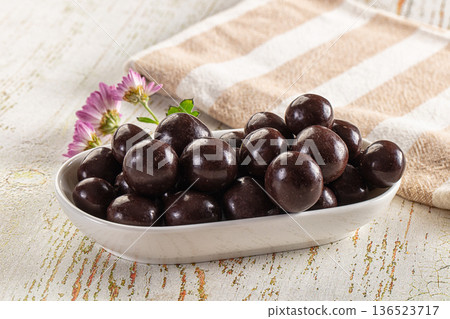 Nut in chocolate balls sweet candy 136523717