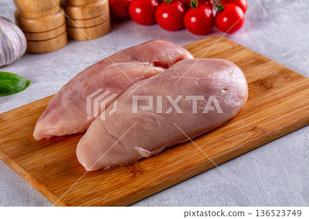 Fresh raw chicken breast over board 136523749