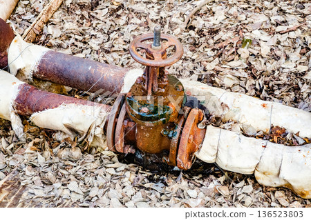 rusty leaky valve on the water pipes rusty leaky valve on the water pipes 136523803