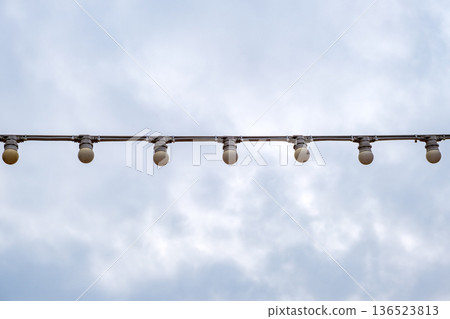 lamps on a garland against the sky lamps on a garland against the sky 136523813