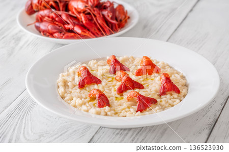 Creamy Italian risotto topped with crawfish tails and olive oil, bright gourmet styling 136523930