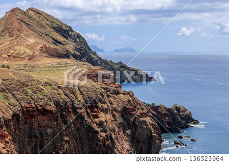 Coastal panorama of Baia Abra, Madeira, arid headland terraces guide the eye to open Atlantic Coastal panorama of Baia Abra, Madeira, arid headland terraces guide the eye to open Atlantic 136523964