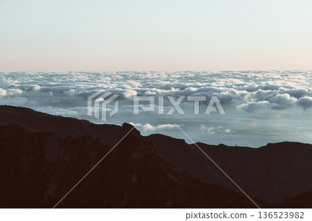 Vintage film style sunrise above sea of clouds and mountain ridge at Sao Roque do Faial Madeira Vintage film style sunrise above sea of clouds and mountain ridge at Sao Roque do Faial Madeira 136523982