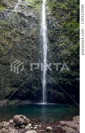 Caldeirao Verde Waterfall on PR9 plunges into an emerald pool in soft mist Caldeirao Verde Waterfall on PR9 plunges into an emerald pool in soft mist 136523996