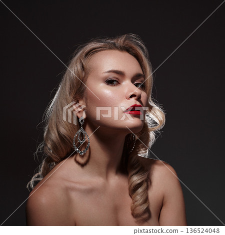 Wealth, Prosperity, Luxury and Richness. Rich Beautiful Woman with Fashion Make-up, Curly Wave Hairstyle, Bright Accessories. Glamour Pin-up Girl with Red lips. Style with Brilliant Earrings and Rings Wealth, Prosperity, Luxury and Richness. Rich Beautiful Woman with Fashion Make-up, Curly Wave Hairstyle, Bright Accessories. Glamour Pin-up Girl with Red lips. Style with Brilliant Earrings and Rings 136524048