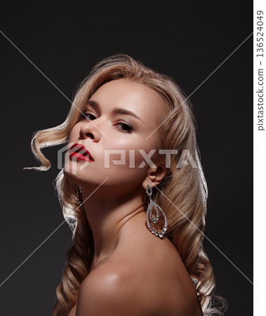 Wealth, Prosperity, Luxury and Richness. Rich Beautiful Woman with Fashion Make-up, Curly Wave Hairstyle, Bright Accessories. Glamour Pin-up Girl with Red lips. Style with Brilliant Earrings and Rings Wealth, Prosperity, Luxury and Richness. Rich Beautiful Woman with Fashion Make-up, Curly Wave Hairstyle, Bright Accessories. Glamour Pin-up Girl with Red lips. Style with Brilliant Earrings and Rings 136524049