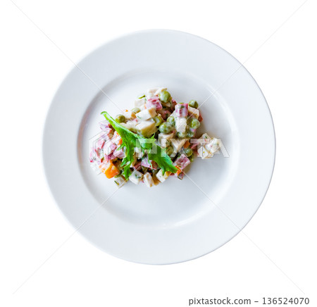 olivier salad on a plate, top view, isolated on white with clipping path olivier salad on a plate, top view, isolated on white with clipping path 136524070