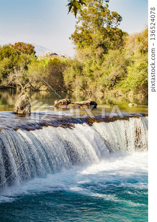 wide waterfall on the river close-up 136524078
