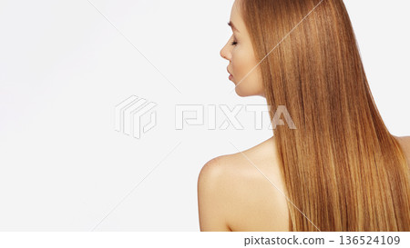 Beautiful young Woman with Long Straight dark Blond Hair. Fashion Model with Smooth Gloss Hairstyle on White Background. Keratin or Hair Botox Treatment. Beauty Salon, Shampoo, Balm or Serum Ad Beautiful young Woman with Long Straight dark Blond Hair. Fashion Model with Smooth Gloss Hairstyle on White Background. Keratin or Hair Botox Treatment. Beauty Salon, Shampoo, Balm or Serum Ad 136524109
