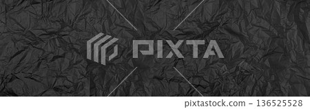 Black crumpled paper texture creating abstract background Black crumpled paper texture creating abstract background 136525528