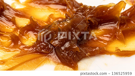 Thick industrial grease smearing a white surface Thick industrial grease smearing a white surface 136525959