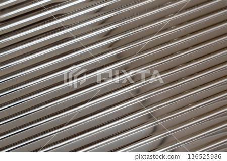 Reflecting metallic diagonal stripes creating abstract pattern Reflecting metallic diagonal stripes creating abstract pattern 136525986