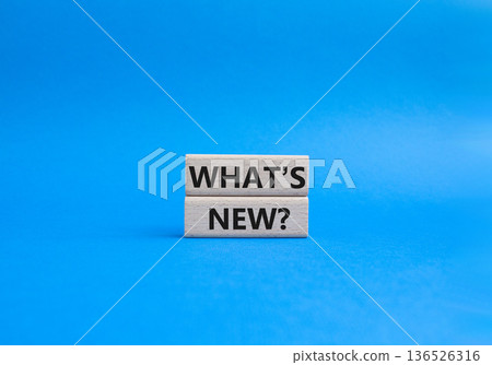 What is new symbol. Concept word What is new on wooden blocks. Beautiful blue background. Business and What is new concept. Copy space What is new symbol. Concept word What is new on wooden blocks. Beautiful blue background. Business and What is new concept. Copy space 136526316