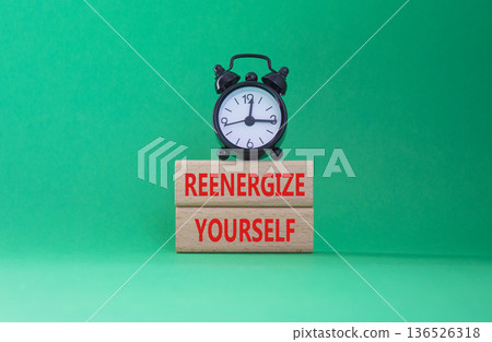 Reenergize yourself symbol. Concept words Reenergize yourself on wooden blocks. Beautiful green background with alarm clock. Mindfulness and Reenergize yourself concept. Copy space. Reenergize yourself symbol. Concept words Reenergize yourself on wooden blocks. Beautiful green background with alarm clock. Mindfulness and Reenergize yourself concept. Copy space. 136526318