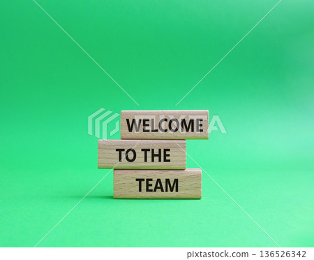 Team symbol. Wooden blocks with words Welcome to the Team. Beautiful green background. Business and Welcome to the Team concept. Copy space. Team symbol. Wooden blocks with words Welcome to the Team. Beautiful green background. Business and Welcome to the Team concept. Copy space. 136526342