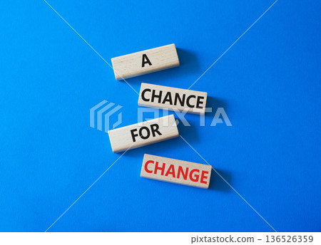 A Chance for Change symbol. Concept words A Chance for Change on wooden blocks. Beautiful bright blue background. Business and A Chance for Change concept. Copy space. 136526359