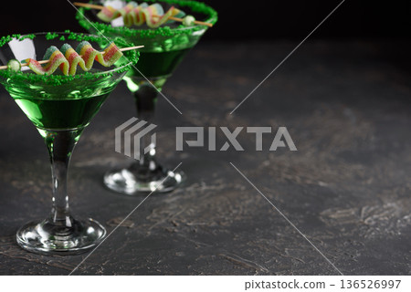 Green Cocktails with Rainbow Candy and Shamrocks. Festive St. Patricks Day Celebration Still Life 136526997