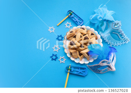 Purim celebration with hamantaschen, masks, noisemaker, and star of david Purim celebration with hamantaschen, masks, noisemaker, and star of david 136527028