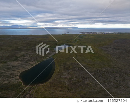 Aerial view Chukotka Arctic coastline pristine tundra wilderness landscape Aerial view Chukotka Arctic coastline pristine tundra wilderness landscape 136527204