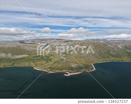 Aerial view Chukotka Arctic coastline pristine tundra wilderness landscape Aerial view Chukotka Arctic coastline pristine tundra wilderness landscape 136527237