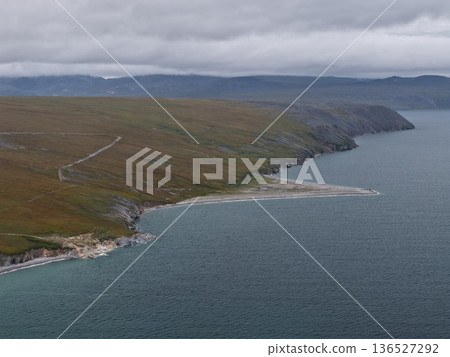 Aerial view Lavrentiya bay Bering waters remote coastal terrain landscape Aerial view Lavrentiya bay Bering waters remote coastal terrain landscape 136527292