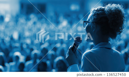 Confident Speaker Engaging Audience: Female Entrepreneur Addressing Business Conference 136527450