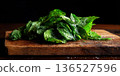 Refreshing Mint Leaves, a Natural Remedy, Battered and Beautiful, on a Wooden Board 136527596